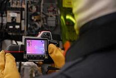 EEC technician performing an IR Scan as part of data center maintenance